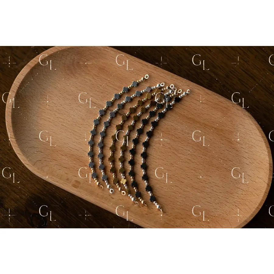 Set of chain saw chains on a wooden tray