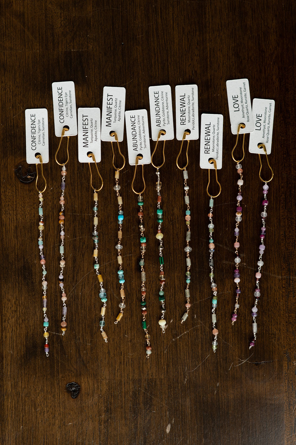 Set of beaded glow up with tags on a wooden surface