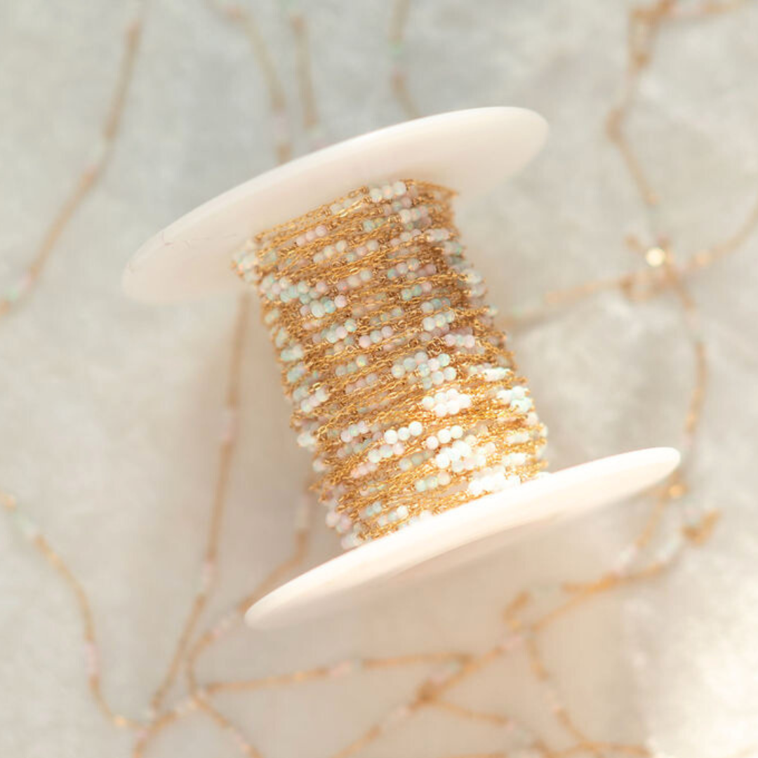 Gold and silver beaded bracelet on a starfish with a marble background