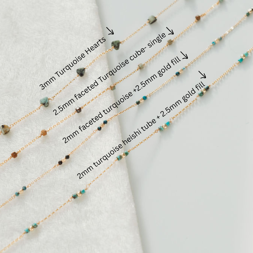 Four gold fill necklaces with turquoise beads on a light gray background