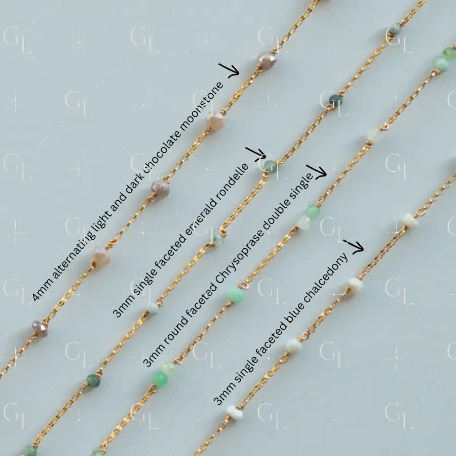 Gold fill chains with various gemstones on a light blue background