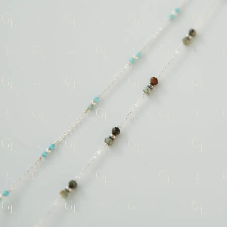 Necklace with multicolored beads on a light gray background