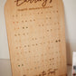 Wooden earring display board with 'Earrings' and 'Business in the Front' text on a white background.