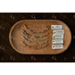Set of beaded bracelets on a wooden tray with corresponding cards on a dark surface