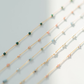 Set of beaded necklaces on a light gray background