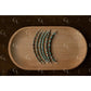 Set of silver and turquoise beaded bracelets on a wooden tray