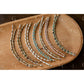 Set of beaded half bracelet on a wooden surface