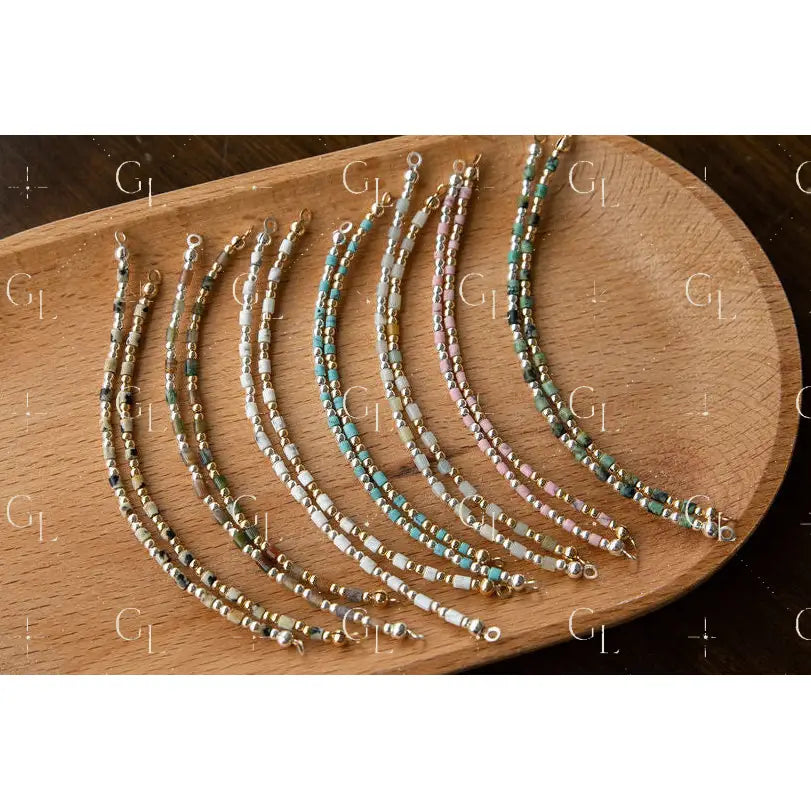 Set of beaded half bracelet on a wooden surface