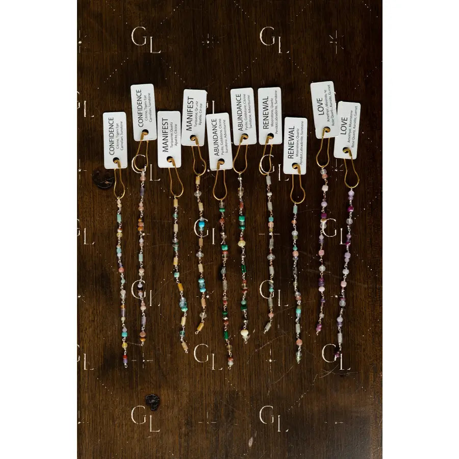 Set of beaded glow up with tags on a wooden surface