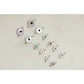 Evil eye charms on a light beige background