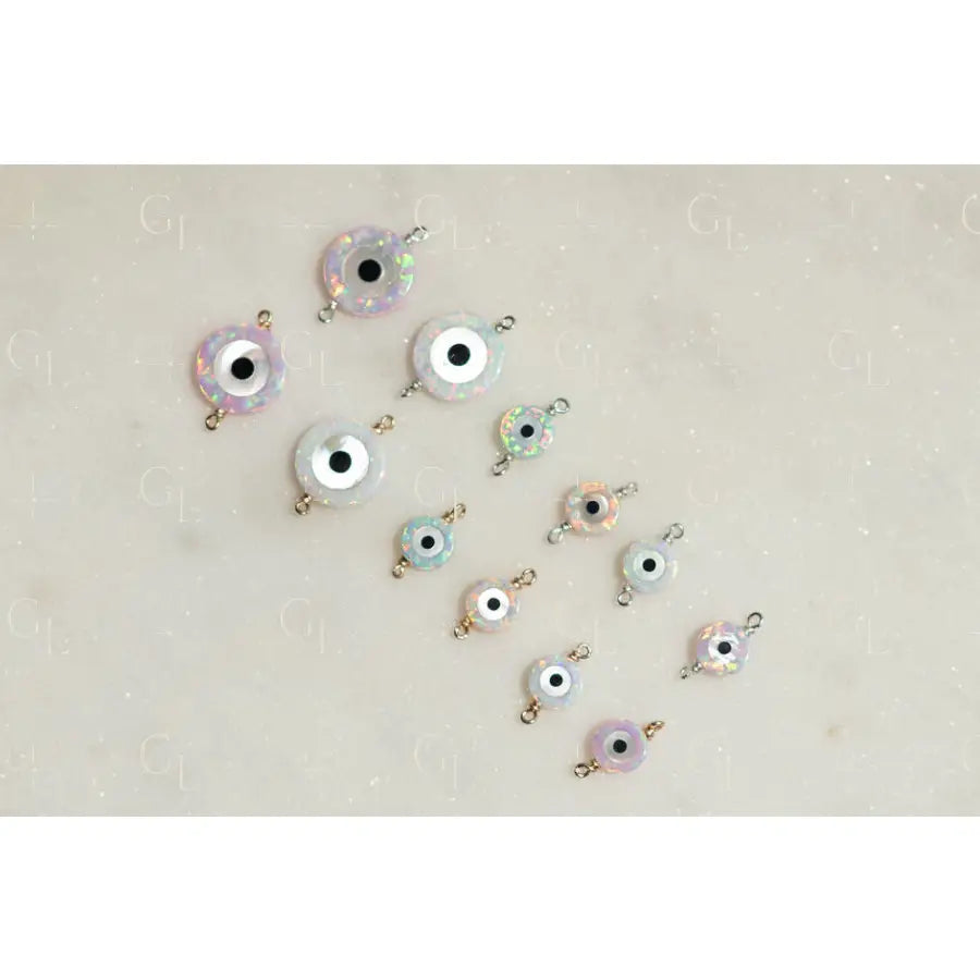 Evil eye charms on a light beige background