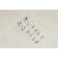 Evil eye charms on a light beige background
