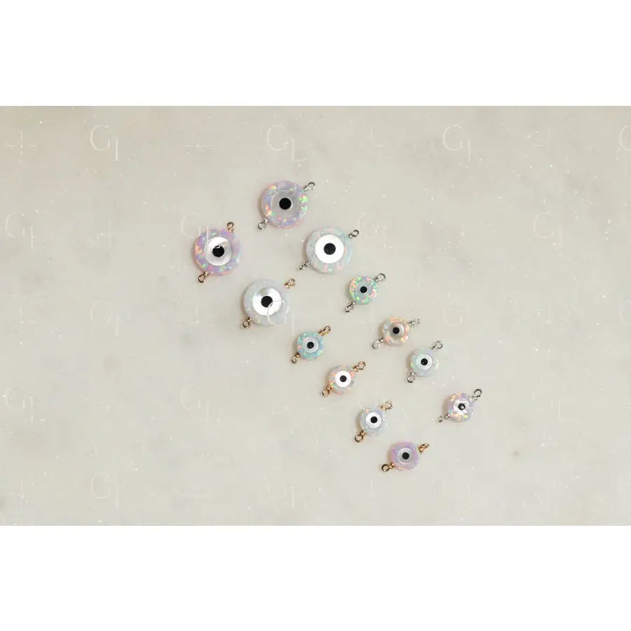 Evil eye charms on a light beige background
