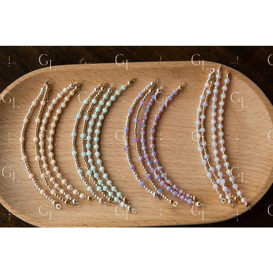 Set of beaded glow up half bead on a wooden surface