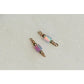 Two beaded charms with iridescent beads on a light gray background opal tube connectors!