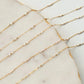 Gold fill chain necklace on a marble surface