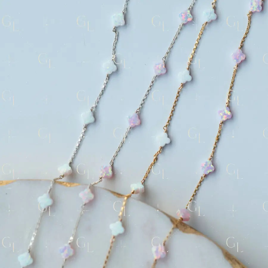 Necklace with opal clover on a light background