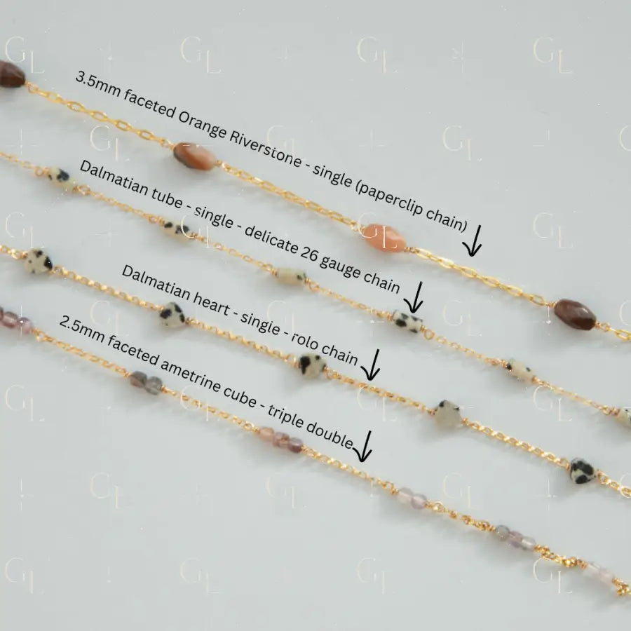 Four gold chains with different bead designs on a light gray background
