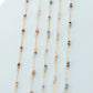Three beaded necklaces with multicolored beads on a light gray background