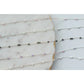 Delicate beaded necklace on a marble surface