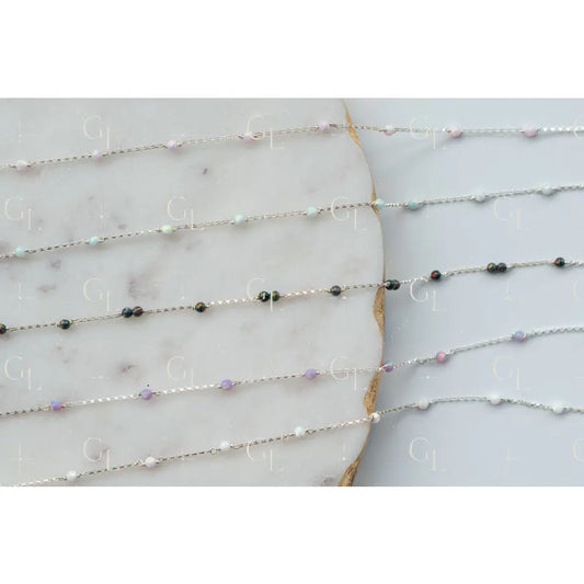 Delicate beaded necklace on a marble surface