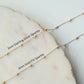 Two gold necklaces with '3mm Sterling Silver Sparkle' and '3mm Gold Fill Sparkle' labels on a marble surface.