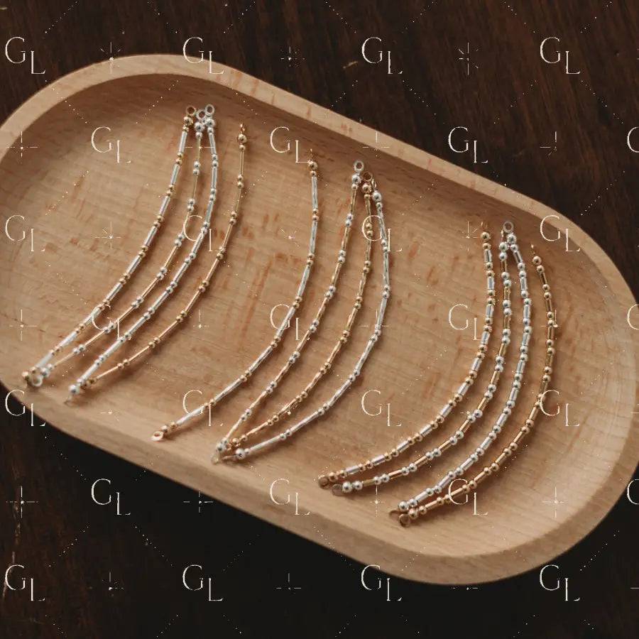Set of gold and silver glow up on a wooden tray